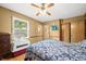 Bedroom with ceiling fan, wood floors and natural light at 3210 Flintwood Dr, Columbus, IN 47203