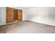 Carpeted bedroom with sliding closet doors and ample natural light at 3210 Flintwood Dr, Columbus, IN 47203