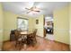 Cozy dining room featuring hardwood floors, a ceiling fan and natural light at 3210 Flintwood Dr, Columbus, IN 47203