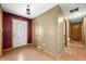 Hallway with wood floors leading to a decorative front door at 3210 Flintwood Dr, Columbus, IN 47203