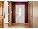 Inviting foyer with wood floors and a decorative front door at 3210 Flintwood Dr, Columbus, IN 47203