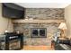 A cozy brick fireplace is the focal point of this comfortable living room at 3210 Flintwood Dr, Columbus, IN 47203