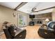 Spacious living room featuring a brick fireplace, wood floors, and sliding door at 3210 Flintwood Dr, Columbus, IN 47203