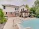 Backyard featuring a pool and a patio with seating and a barbecue grill at 4075 Dartmoor Dr, Greenwood, IN 46143