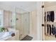 Bathroom featuring a large glass shower and a closet with hanging clothes at 4075 Dartmoor Dr, Greenwood, IN 46143