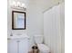 Well-lit bathroom with a shower and tub, a modern sink, and a vanity at 4075 Dartmoor Dr, Greenwood, IN 46143