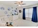 Bright room features modern décor and a ceiling fan at 4075 Dartmoor Dr, Greenwood, IN 46143