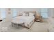 Comfortable bedroom with neutral decor, a tufted headboard, and plenty of natural light from the window at 4075 Dartmoor Dr, Greenwood, IN 46143