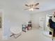 Bright bedroom featuring neutral walls and carpet, ceiling fan, and natural light from the window at 4075 Dartmoor Dr, Greenwood, IN 46143