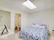 Bright bedroom featuring fresh white walls, a walk-in closet, and an en-suite bathroom at 4075 Dartmoor Dr, Greenwood, IN 46143