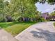 Beautiful brick home with a curved driveway and professionally landscaped yard at 4075 Dartmoor Dr, Greenwood, IN 46143
