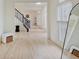Bright open foyer featuring hardwood floors, a staircase, and ample natural light at 4075 Dartmoor Dr, Greenwood, IN 46143