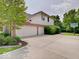 Spacious three-car garage with ample parking and a basketball hoop at 4075 Dartmoor Dr, Greenwood, IN 46143
