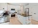 Well-equipped kitchen with an island, stainless steel appliances, and ample cabinet space at 4075 Dartmoor Dr, Greenwood, IN 46143