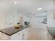 Bright and airy kitchen with a center island and modern finishes and an open layout to the living room at 4075 Dartmoor Dr, Greenwood, IN 46143