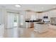 Bright kitchen with white cabinets, stainless steel appliances, an island, and a view of the pool at 4075 Dartmoor Dr, Greenwood, IN 46143