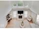 Vaulted living room with fireplace, tv, and natural light, creating a bright and inviting space at 4075 Dartmoor Dr, Greenwood, IN 46143