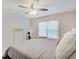 Comfortable main bedroom with a queen bed, carpet, and natural light from the window at 4075 Dartmoor Dr, Greenwood, IN 46143