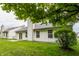 The backyard features a well-maintained lawn, mature trees, and a patio at 4103 Caddy Way, Indianapolis, IN 46268