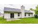 The backyard features a well-maintained lawn and a sliding door leading to the home at 4103 Caddy Way, Indianapolis, IN 46268