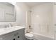 Bathroom features a vanity with a gray cabinet, marble top, and a shower/tub combo at 4103 Caddy Way, Indianapolis, IN 46268