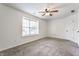 An empty bedroom with carpet and a window with blinds at 4103 Caddy Way, Indianapolis, IN 46268