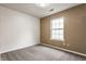 Bright bedroom featuring neutral carpet and a window that provides natural light at 4103 Caddy Way, Indianapolis, IN 46268