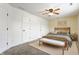 Cozy bedroom with a comfortable bed, ceiling fan, and ample natural light creating a serene retreat at 4103 Caddy Way, Indianapolis, IN 46268