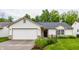 Charming single-story home with a well-manicured lawn and attached garage, perfect for suburban living at 4103 Caddy Way, Indianapolis, IN 46268