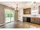 Updated kitchen with stainless steel appliances, granite countertops, and access to the backyard at 4103 Caddy Way, Indianapolis, IN 46268