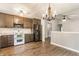 Modern kitchen with stainless steel appliances, granite countertops, and an open view to the living space at 4103 Caddy Way, Indianapolis, IN 46268
