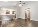 A bright living room featuring an open floor plan with a view into the updated kitchen at 4103 Caddy Way, Indianapolis, IN 46268