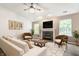 Bright and airy living room featuring a fireplace, ceiling fan, and stylish decor for comfortable living at 4103 Caddy Way, Indianapolis, IN 46268