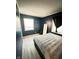 Cozy bedroom with wood-look floors and a large window at 4108 Patricia St, Indianapolis, IN 46222