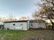 Back exterior of home with vinyl siding and grass yard at 4108 Patricia St, Indianapolis, IN 46222