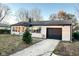 Charming single-story home with a well-maintained lawn and an attached garage at 4108 Patricia St, Indianapolis, IN 46222