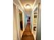 Hallway with wood flooring leading to other rooms at 4108 Patricia St, Indianapolis, IN 46222