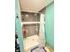 Bathroom shower stall with blue tile and shower caddy at 4108 Patricia St, Indianapolis, IN 46222