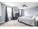 Bedroom with ceiling fan, a TV, and natural light, for a cozy and functional retreat at 422 Sanders St, Indianapolis, IN 46225