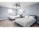 Bright bedroom featuring two beds, ceiling fan, and carpeted floors for a comfortable living space at 422 Sanders St, Indianapolis, IN 46225