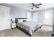 Bedroom featuring carpet, ceiling fan, and light blue walls for a serene space to relax and unwind at 422 Sanders St, Indianapolis, IN 46225