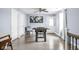 A bonus room showcasing a foosball table, hardwood floors, and access to a staircase, perfect for entertainment at 422 Sanders St, Indianapolis, IN 46225