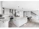 Bright kitchen with stainless steel appliances, granite countertops, a large island, and an adjacent breakfast area at 422 Sanders St, Indianapolis, IN 46225