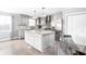Updated kitchen featuring stainless appliances, stone countertops and backsplash, plus generous cabinet and drawer space at 422 Sanders St, Indianapolis, IN 46225