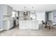 Modern kitchen featuring white cabinets, granite countertops, stainless steel appliances, and an island at 422 Sanders St, Indianapolis, IN 46225