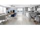 Open-concept living space with light hardwood floors, comfortable seating, and a modern kitchen at 422 Sanders St, Indianapolis, IN 46225