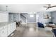 Open living space with hardwood floors connecting the kitchen, dining area, and living room at 422 Sanders St, Indianapolis, IN 46225