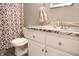 Bathroom showcasing a vanity with granite countertop, toilet and geometric design shower curtain at 4442 Victory Cir, Indianapolis, IN 46203
