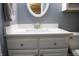 Bathroom features a white vanity with brushed nickel hardware, a white toilet, and gray walls at 4442 Victory Cir, Indianapolis, IN 46203