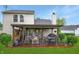 Inviting covered patio with comfortable seating, a dining area, and string lights, creating a relaxing outdoor space at 4442 Victory Cir, Indianapolis, IN 46203